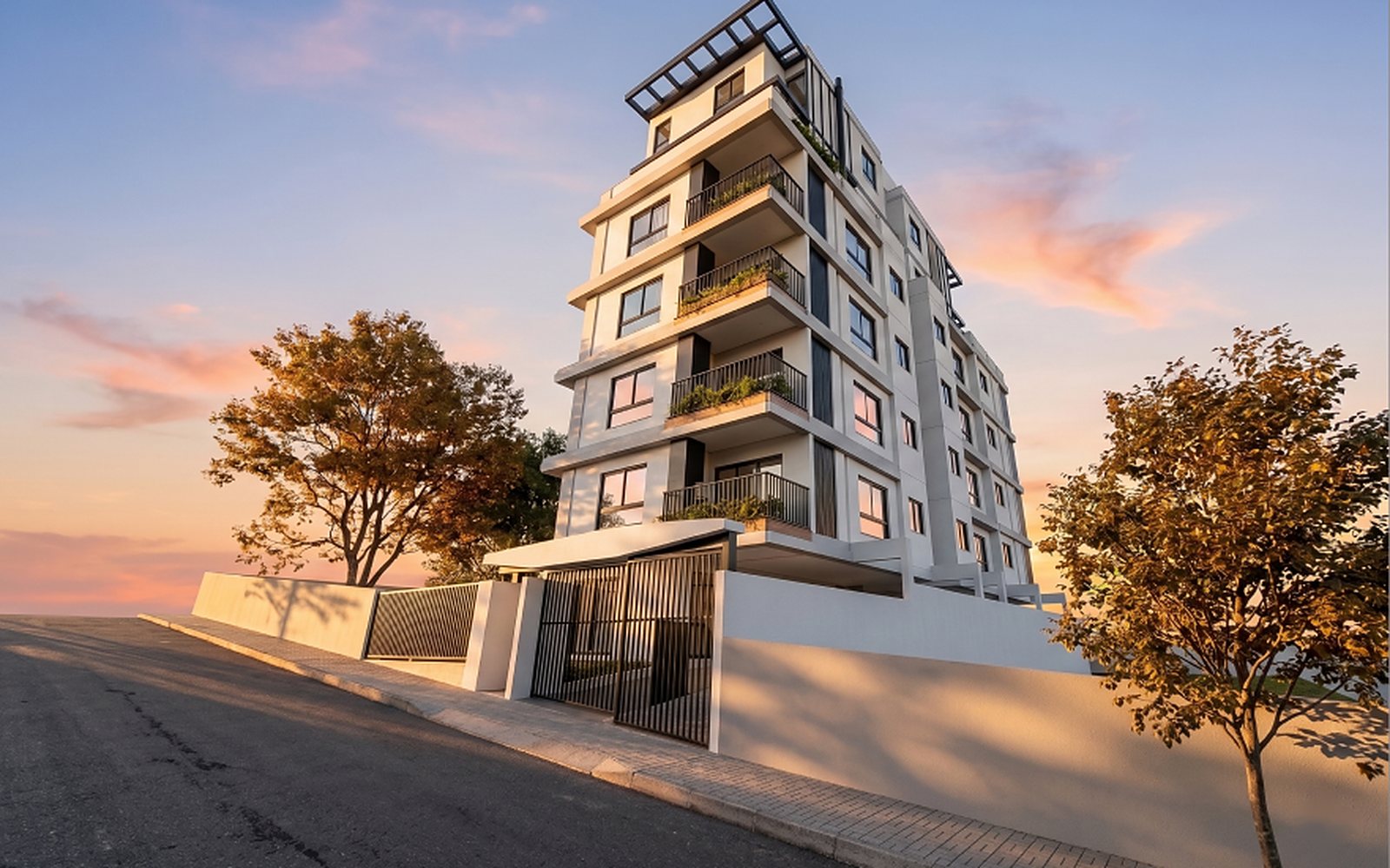 Edifício residencial com varandas jardim ao entardecer